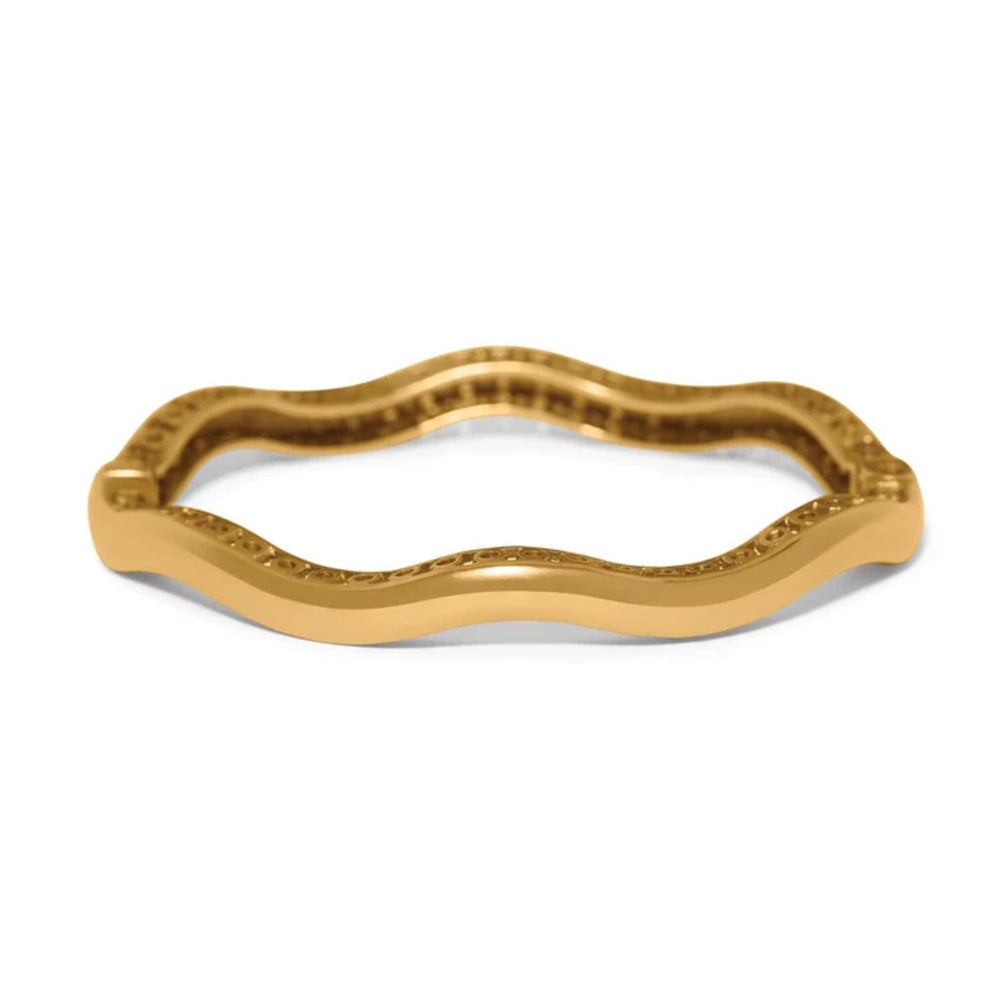 Gold bangle on a white background