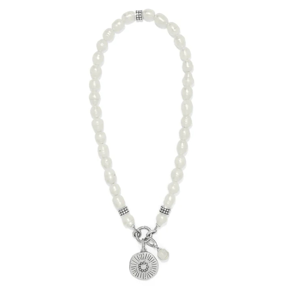 Pearl necklace with a silver charm on a white background