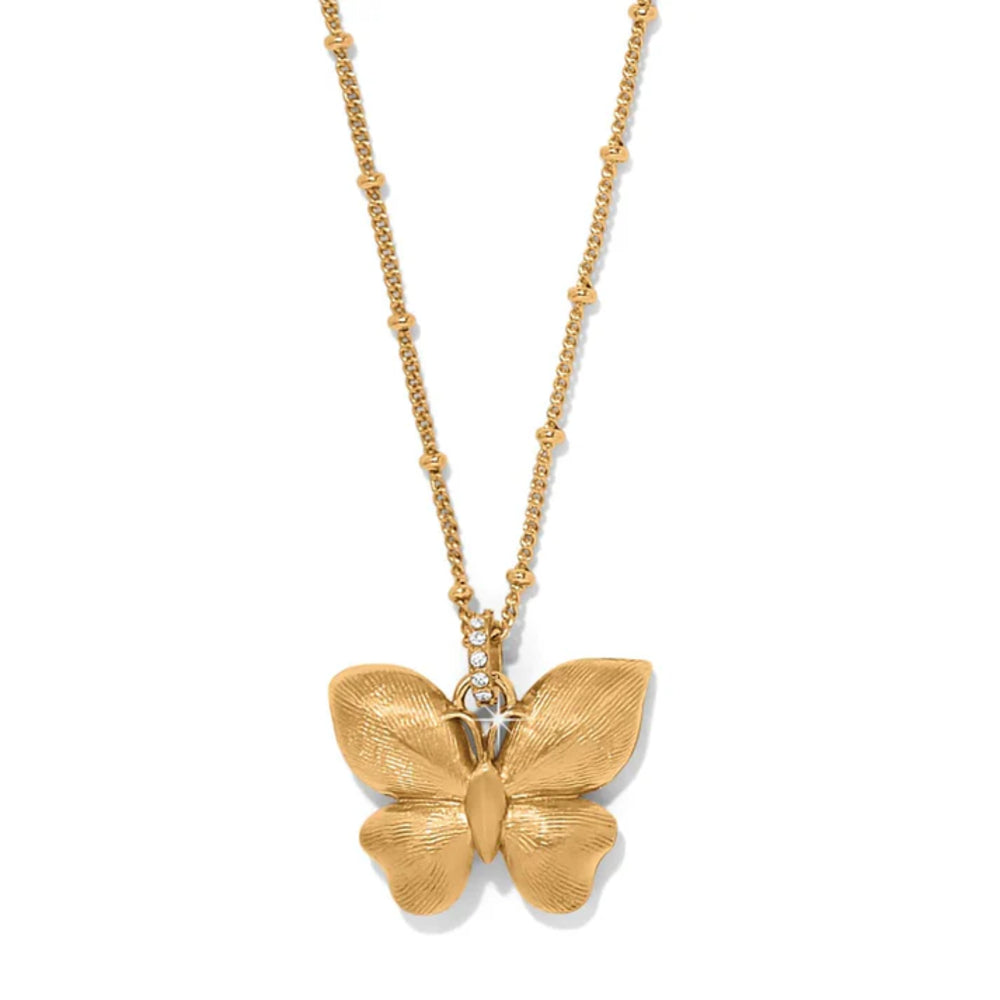 Gold butterfly pendant necklace on a white background