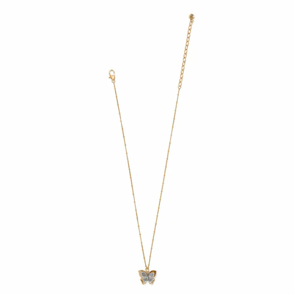 Gold butterfly pendant necklace on a white background