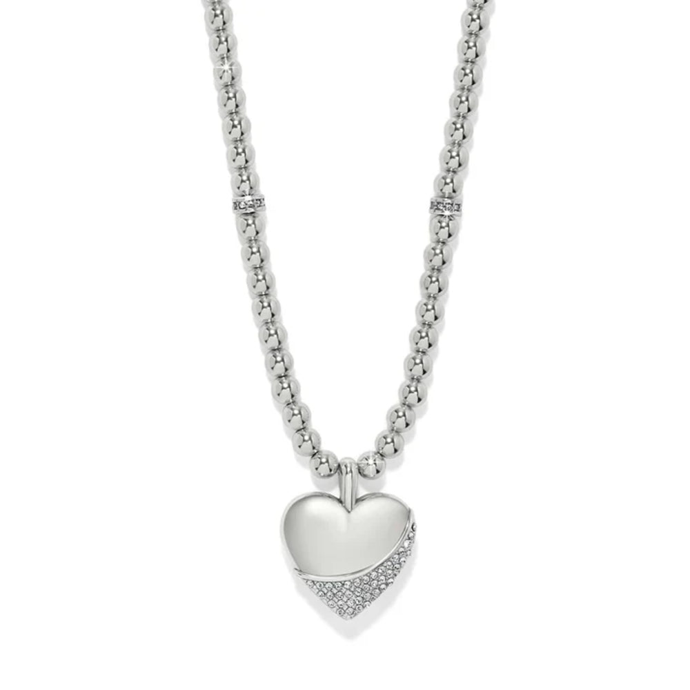A silver heart pendant necklace with a polished heart center and a pavé-set diamond lower edge, suspended from a beaded silver chain on a white background.
