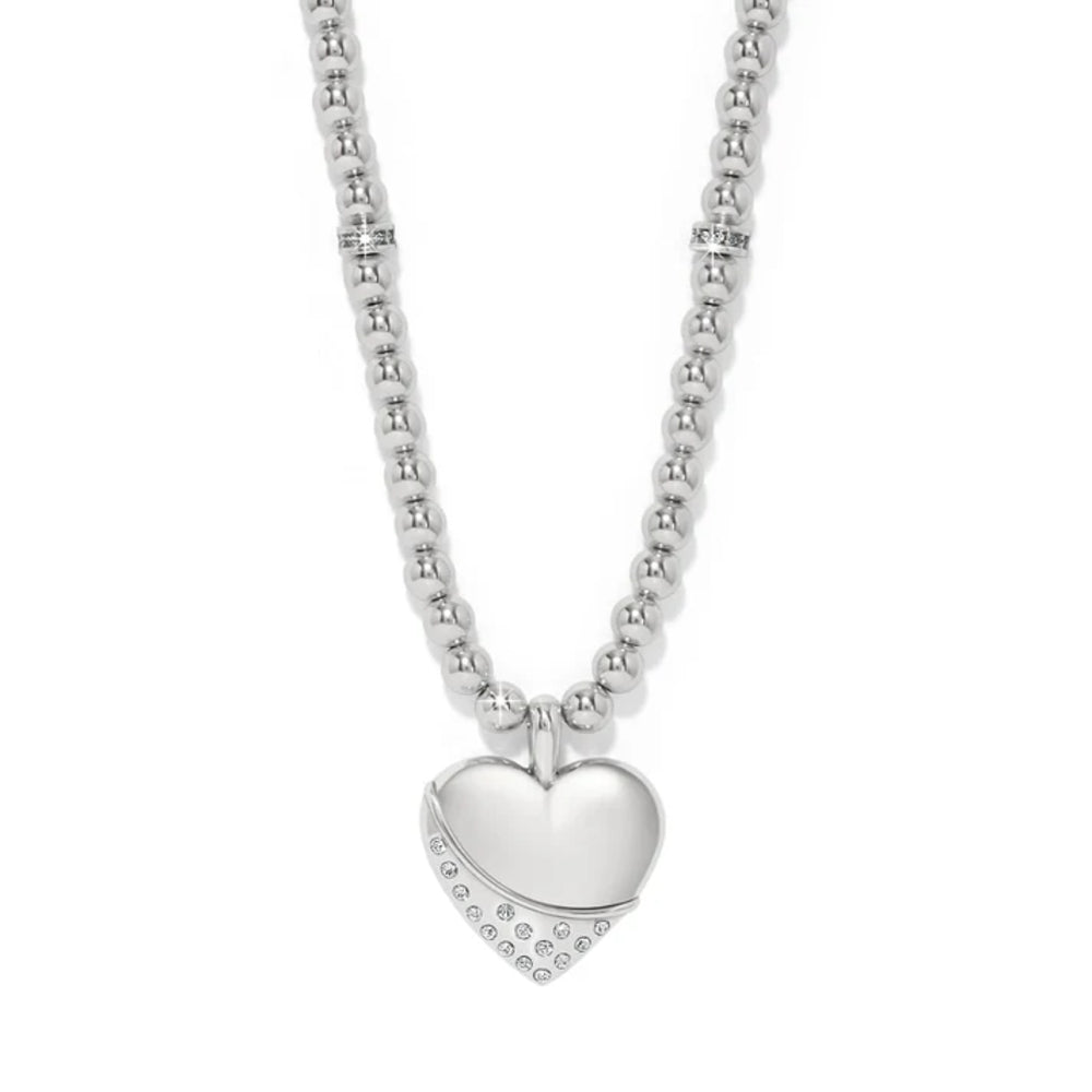 A silver beaded necklace with a polished heart-shaped pendant adorned with small clear stones along one edge, shown against a plain white background.