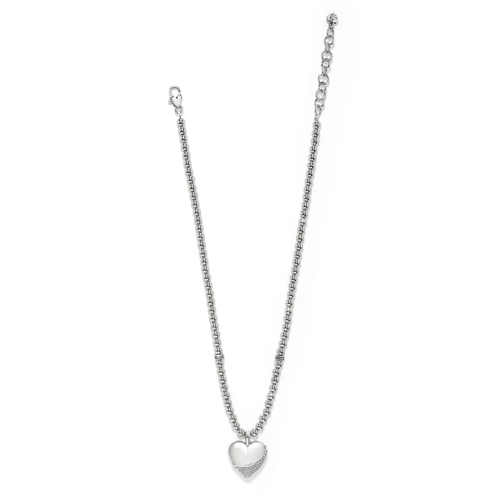 Silver necklace with a heart pendant on a white background