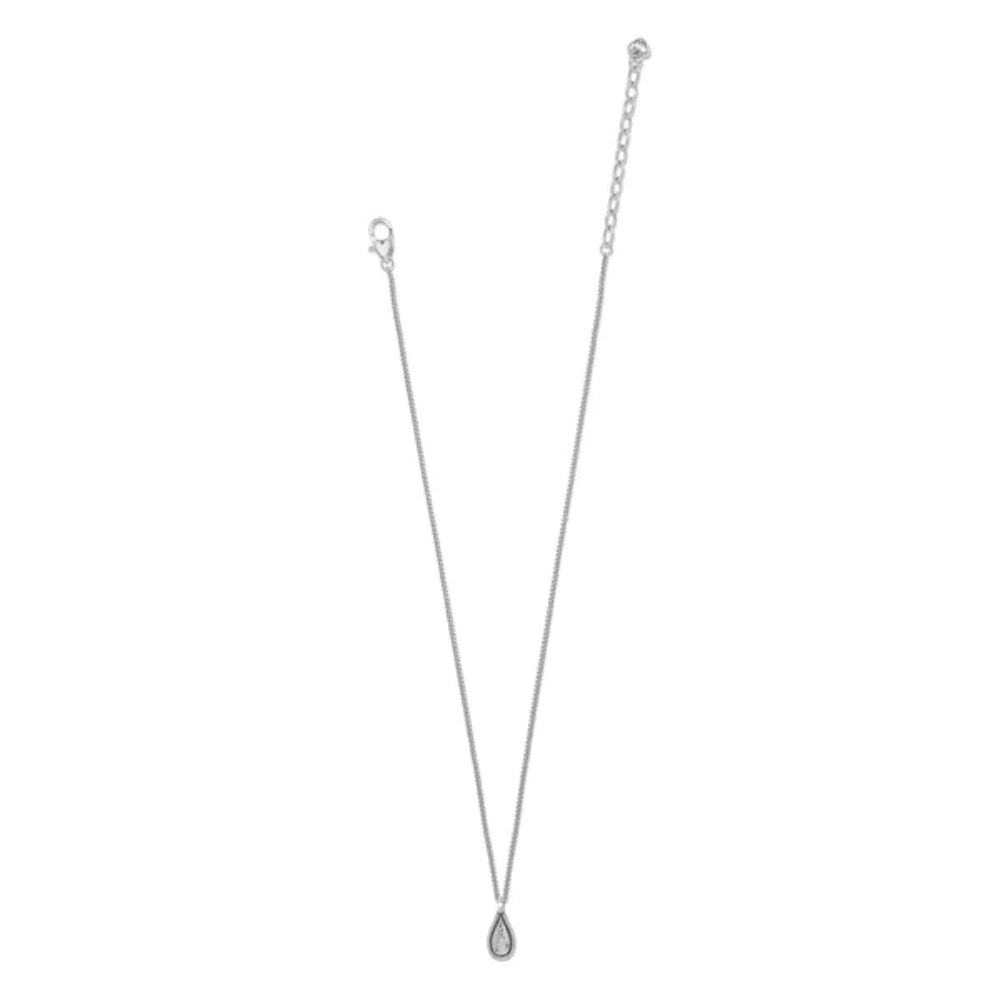 Silver necklace with a teardrop pendant on a white background