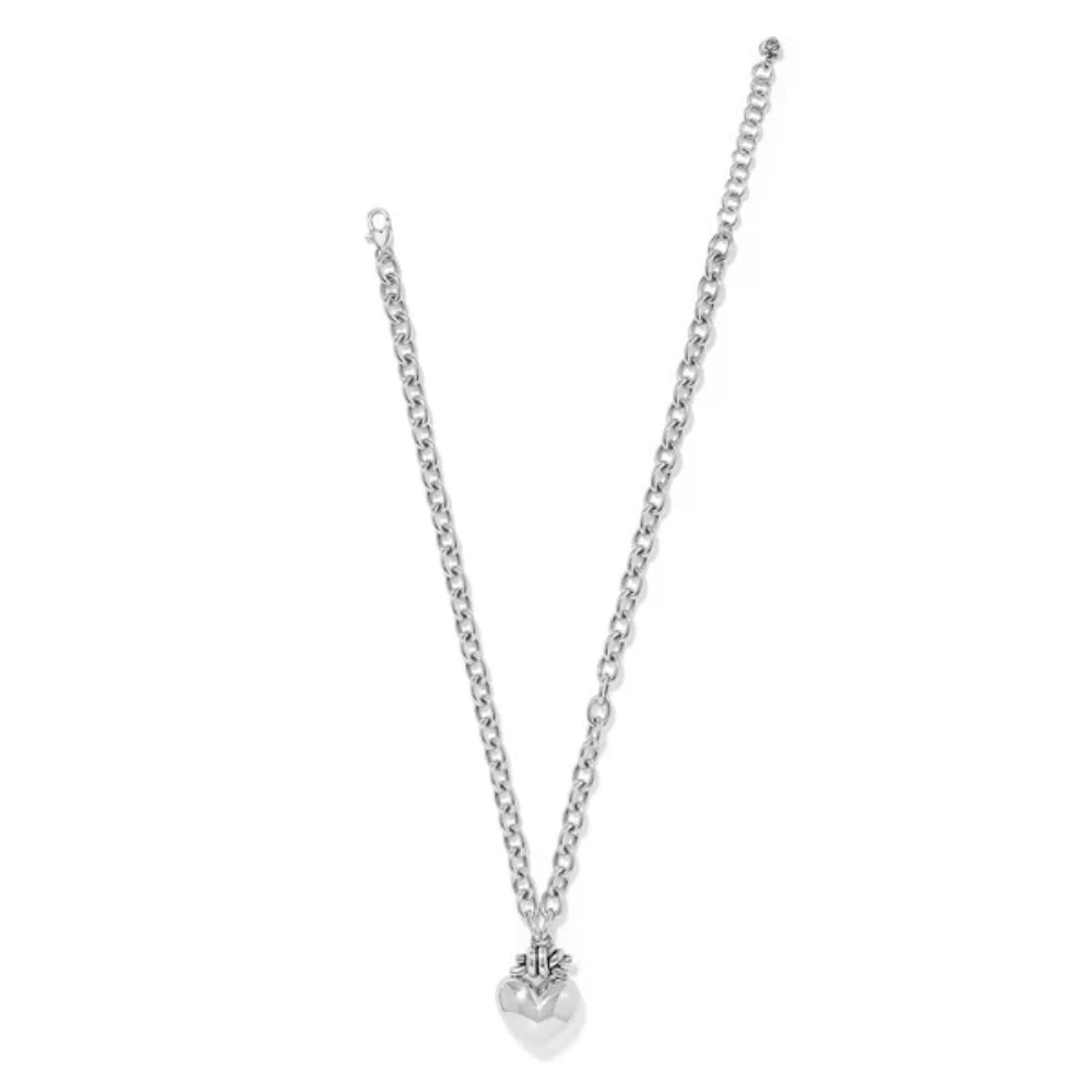 Silver necklace with a heart pendant on a white background