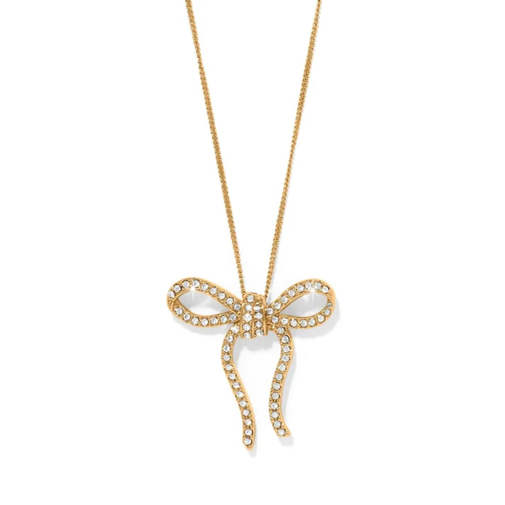 Gold bow-shaped pendant necklace on a white background