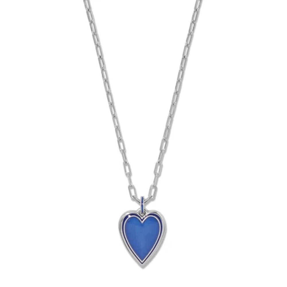 A silver chain necklace with a heart-shaped pendant featuring a vibrant blue inlay, set against a plain white background.