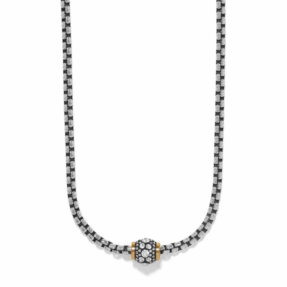 A silver-toned box chain necklace with a central round charm featuring a black and white patterned center and gold-toned side accents, shown on a plain white background.