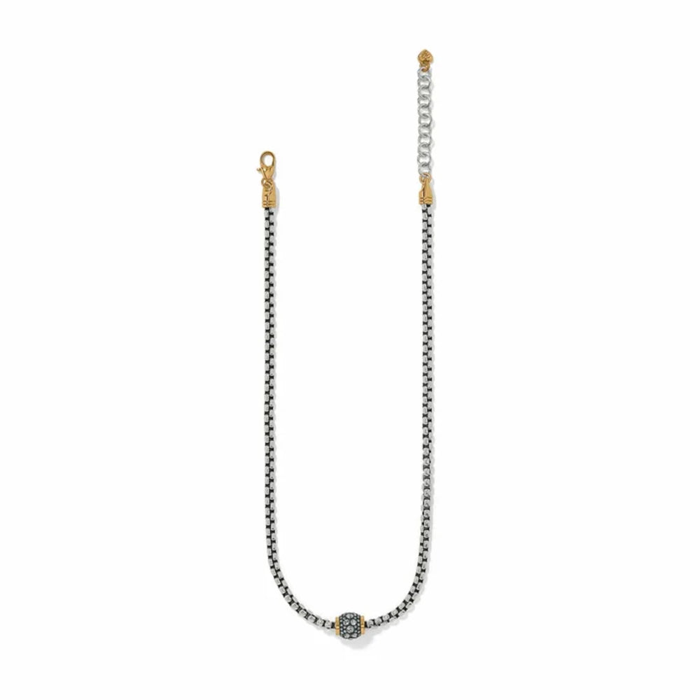 A silver-toned beaded chain necklace with a central oval charm featuring a blue and gold pattern, finished with gold-toned lobster clasp and extender.