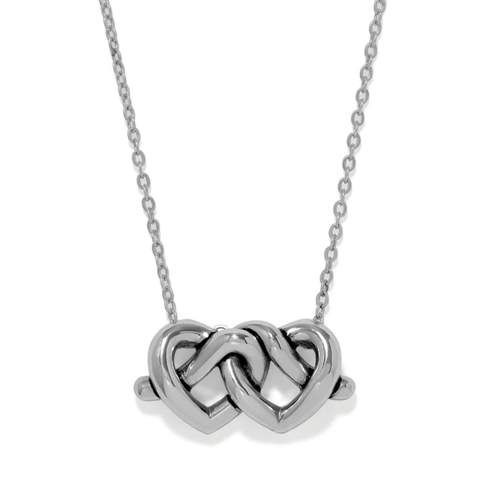 Silver necklace with a double heart pendant on a white background
