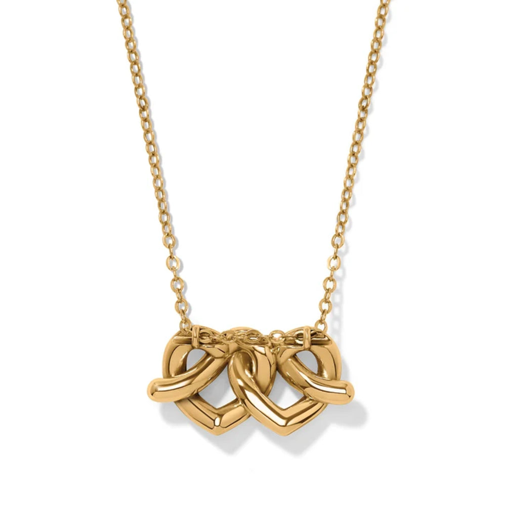 A gold necklace featuring a pendant made of three interlocking heart shapes on a delicate chain, shown against a plain white background.