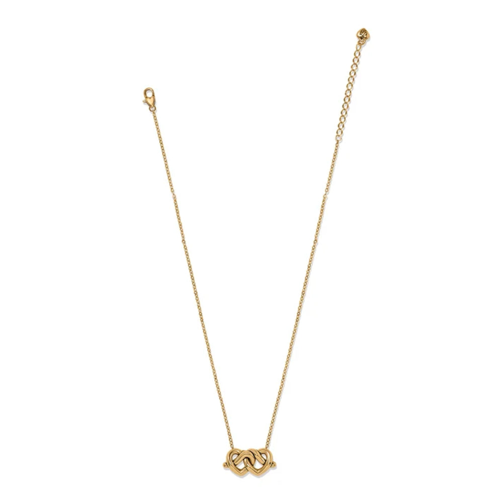 A delicate gold chain necklace with a small interlocking heart-ring pendant, displayed on a clean white background.