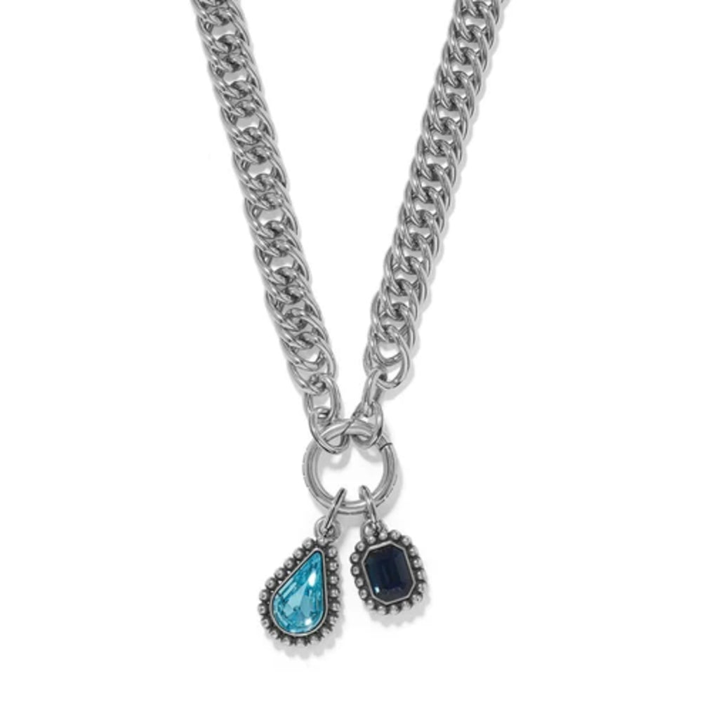 Silver chain necklace with two pendant charms on a white background