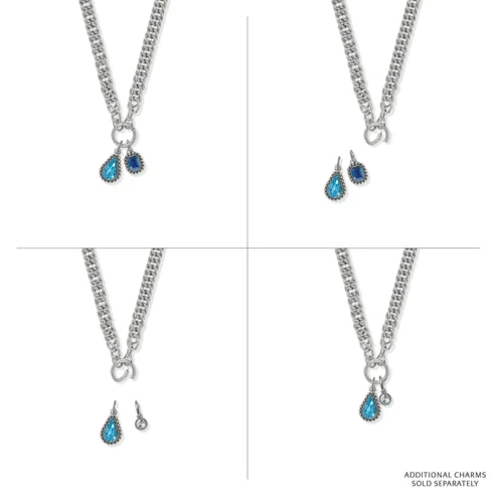 Four-panel product display of a silver-tone chain necklace with a teardrop pendant featuring a bright blue center stone and a smaller dark blue stone, shown with matching drop earrings on a white background.