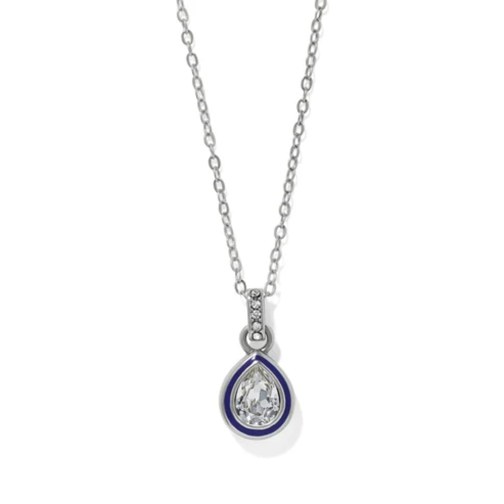 Crystal and enamel necklace on a thin silver chain against a white background
