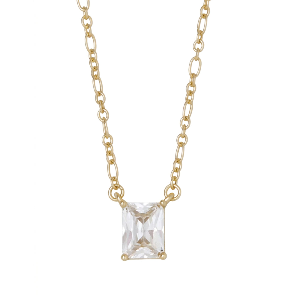 A delicate gold chain necklace featuring a rectangular clear gemstone pendant in a four-prong setting, shown against a plain white background.