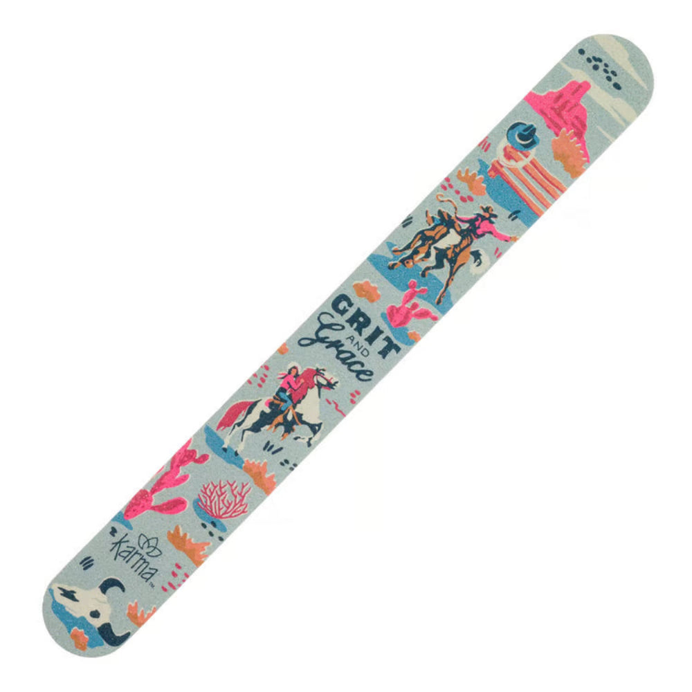A cowboy themed nail file that has a light blue-gray base with a colorful illustrated pattern featuring horses, figures, coral-like shapes, and the words 'GRIT and GRACE' plus 'Karma' near one end.