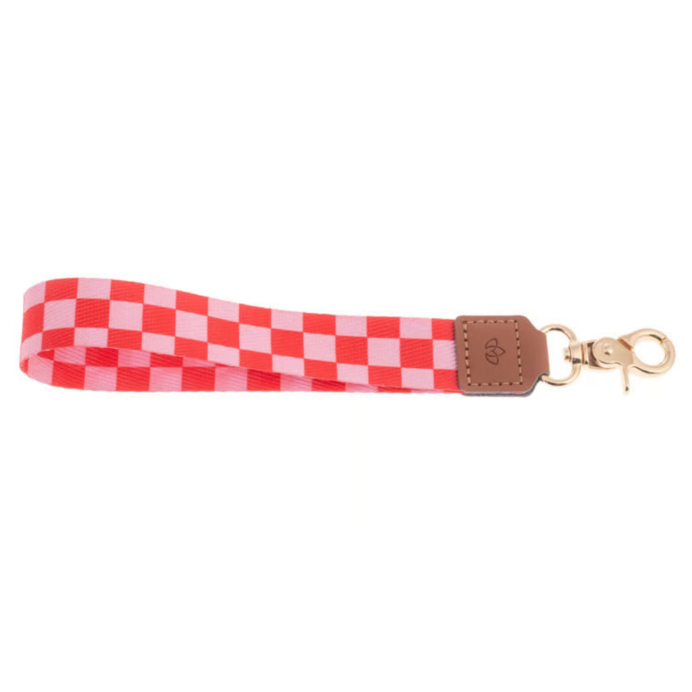 Red and white checkered strap with a brown leather patch and gold clasp on a white background.