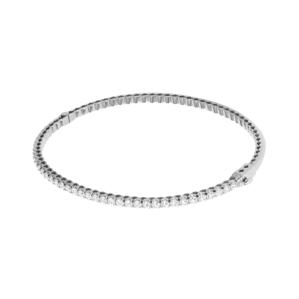 Thin white gold bracelet with diamonds on a white background