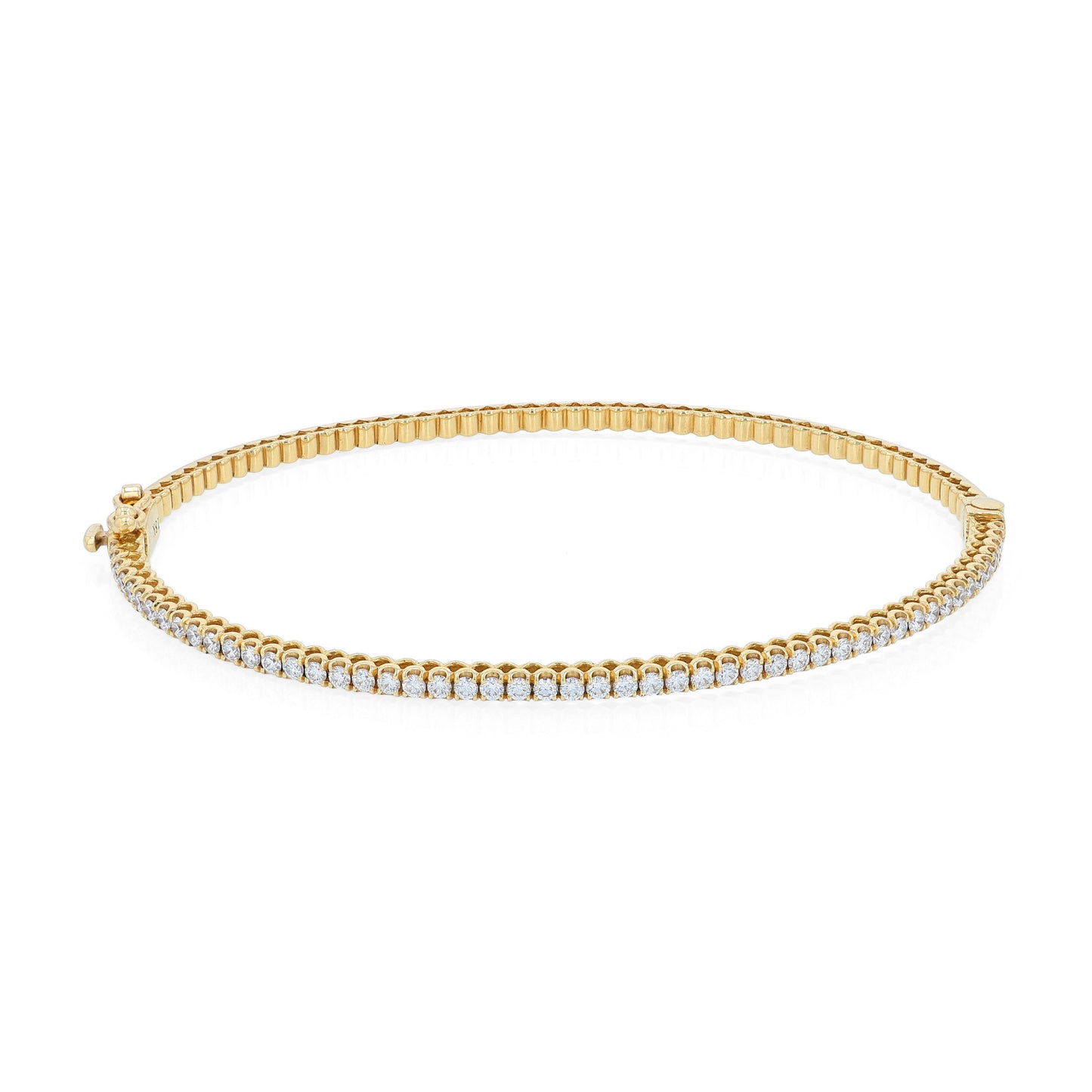 Thin yellow gold bracelet with diamonds on a white background