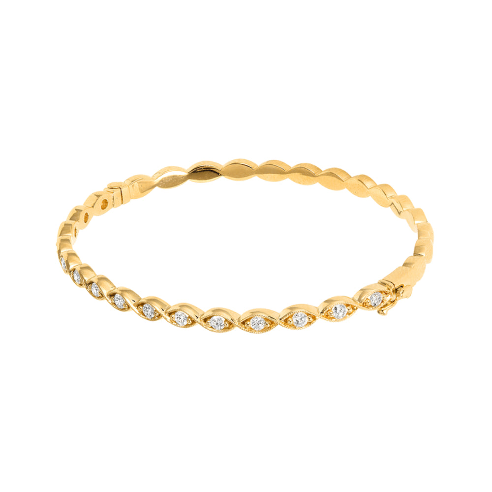 Yellow gold navette style bracelet with diamond accents on a white background