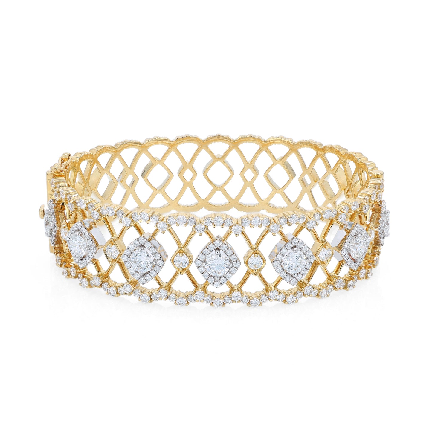 Gold open work design bracelet with diamond accents on a white background