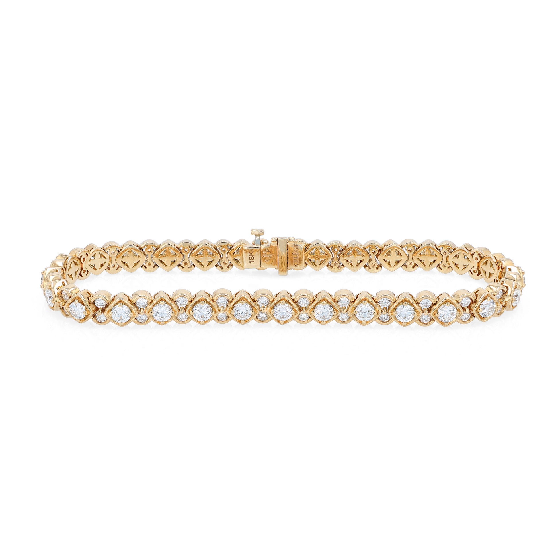 Yellow gold bracelet with diamond accents on a white background