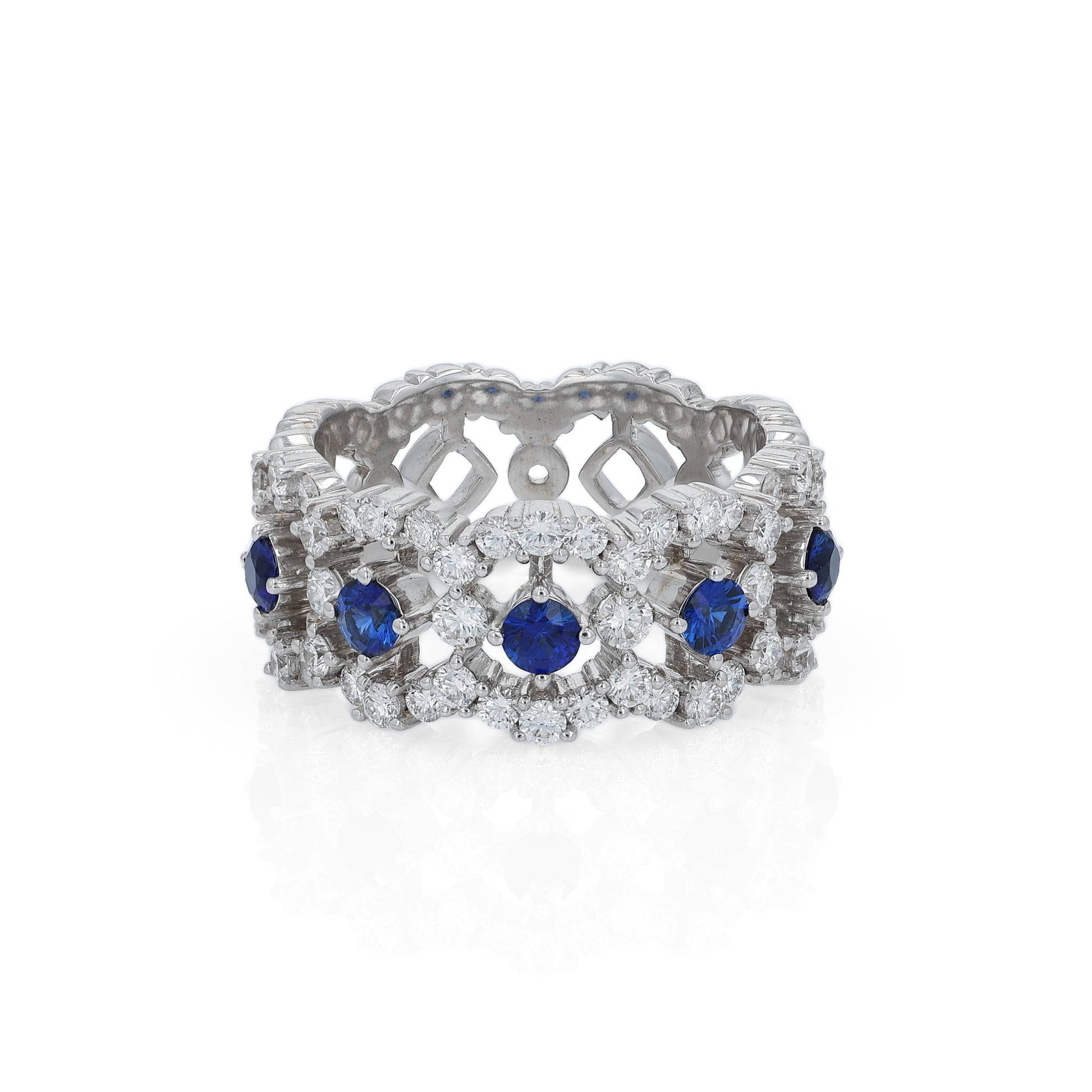 White gold open work band with diamond and blue sapphire accents on a white background