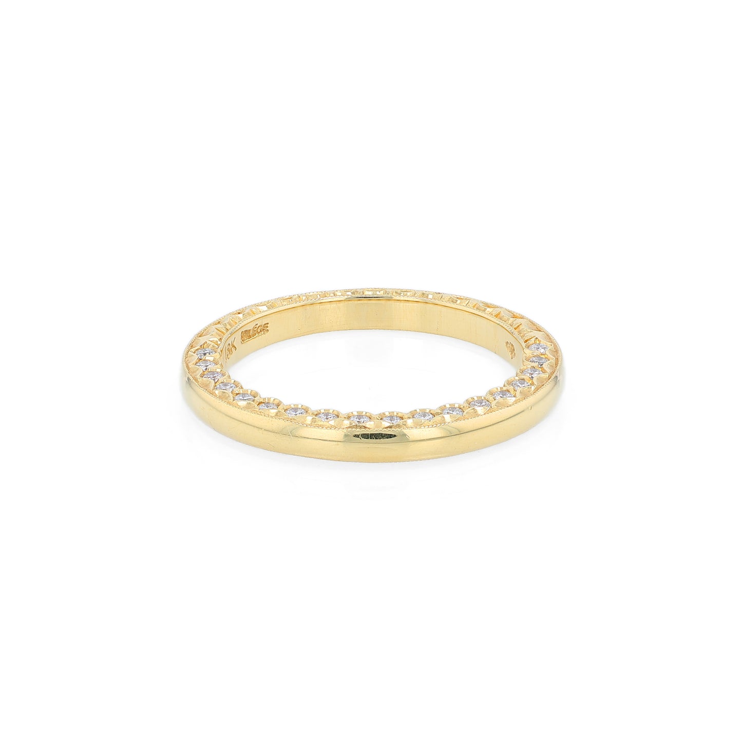 Yellow gold wedding band with diamond accents on a white background