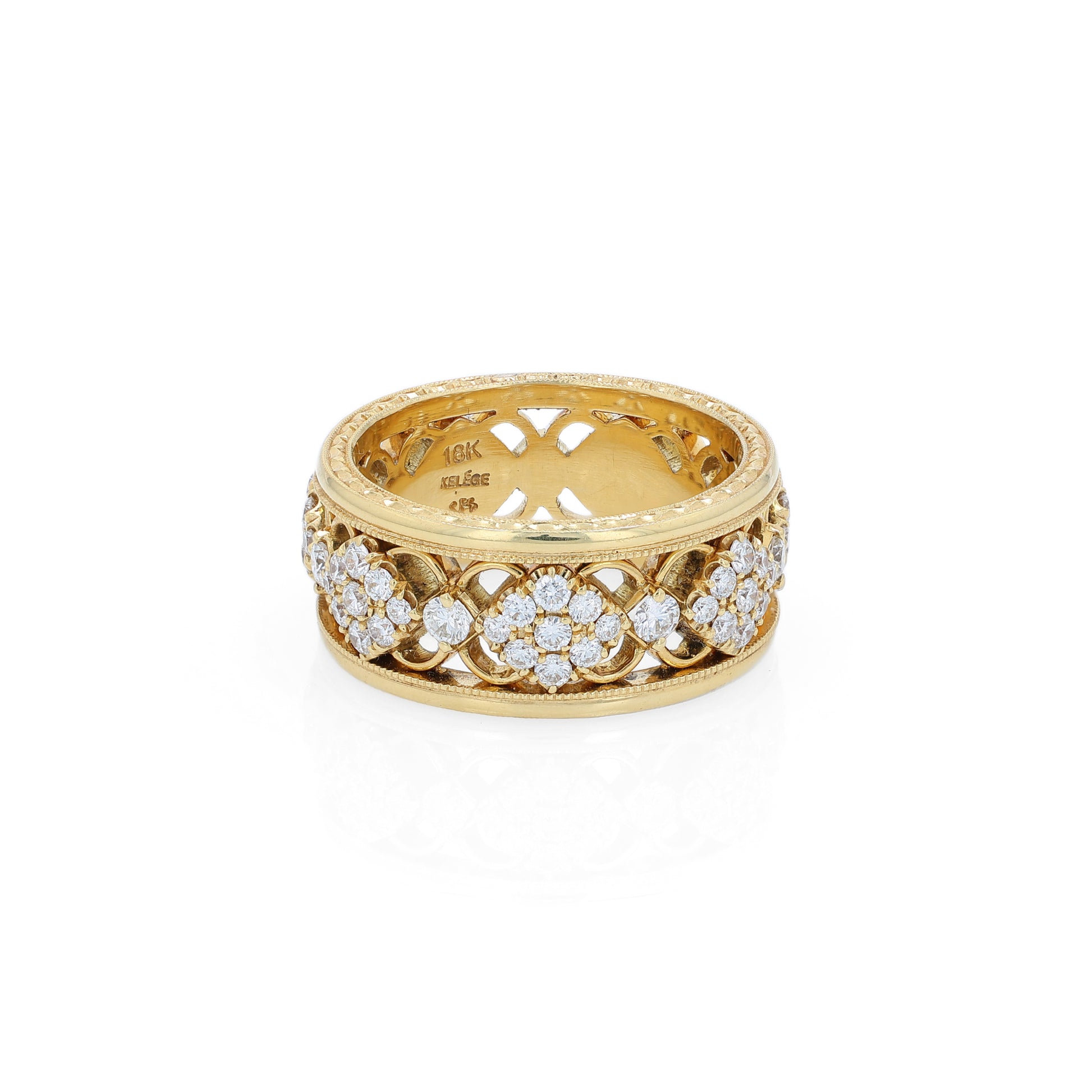 Yellow gold ring with diamond accents on a white background