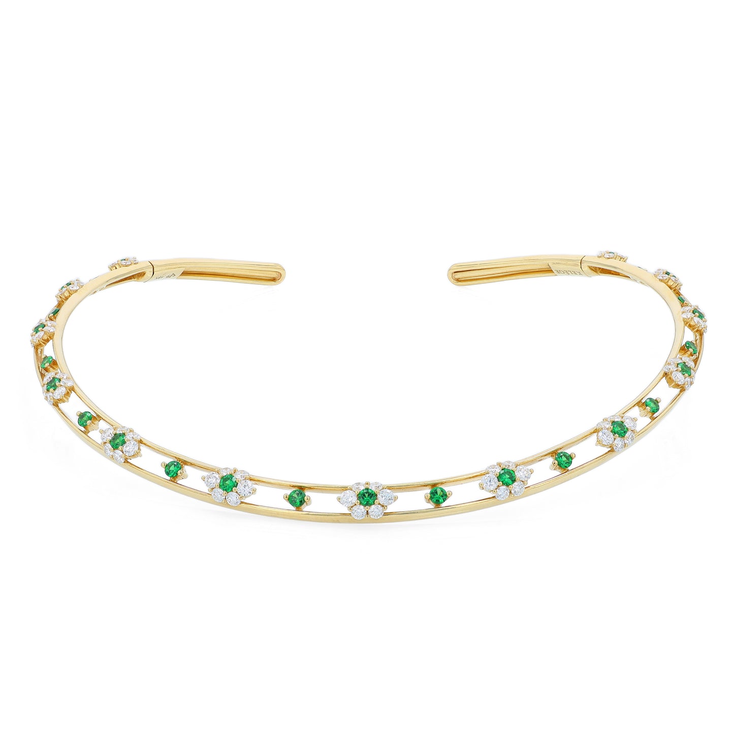 Gold collar necklace with diamond and green tsavorite accents on a white background