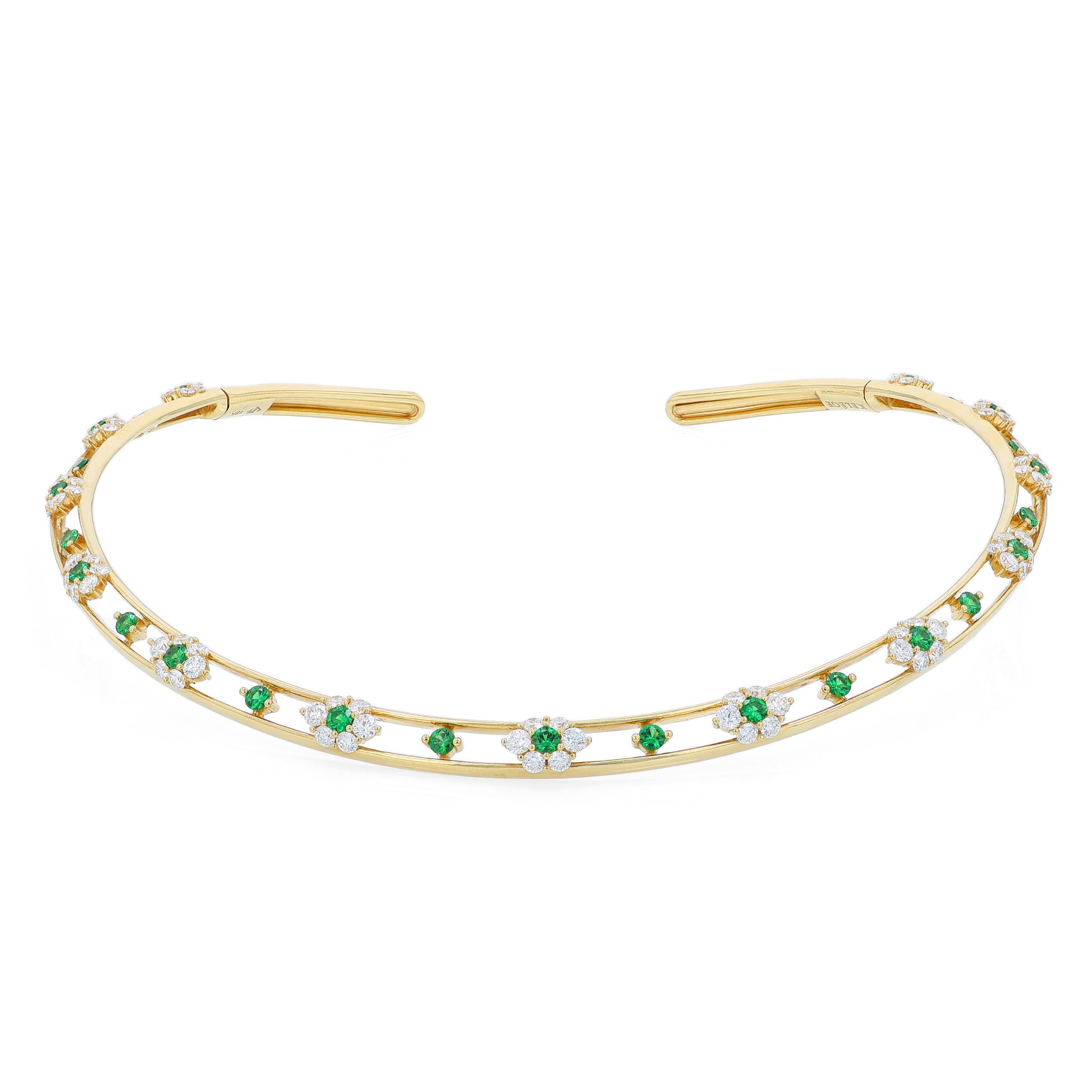Gold collar necklace with diamond and green tsavorite accents on a white background