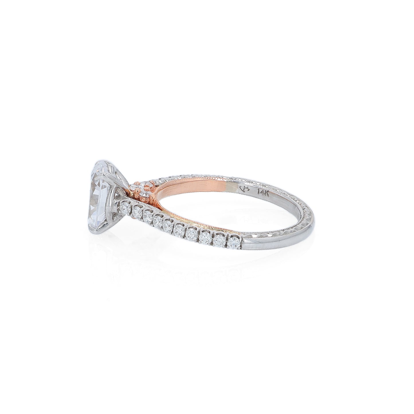 Two-tone gold diamond engagement ring with diamond accents and an oval cubic zirconia center on a white background
