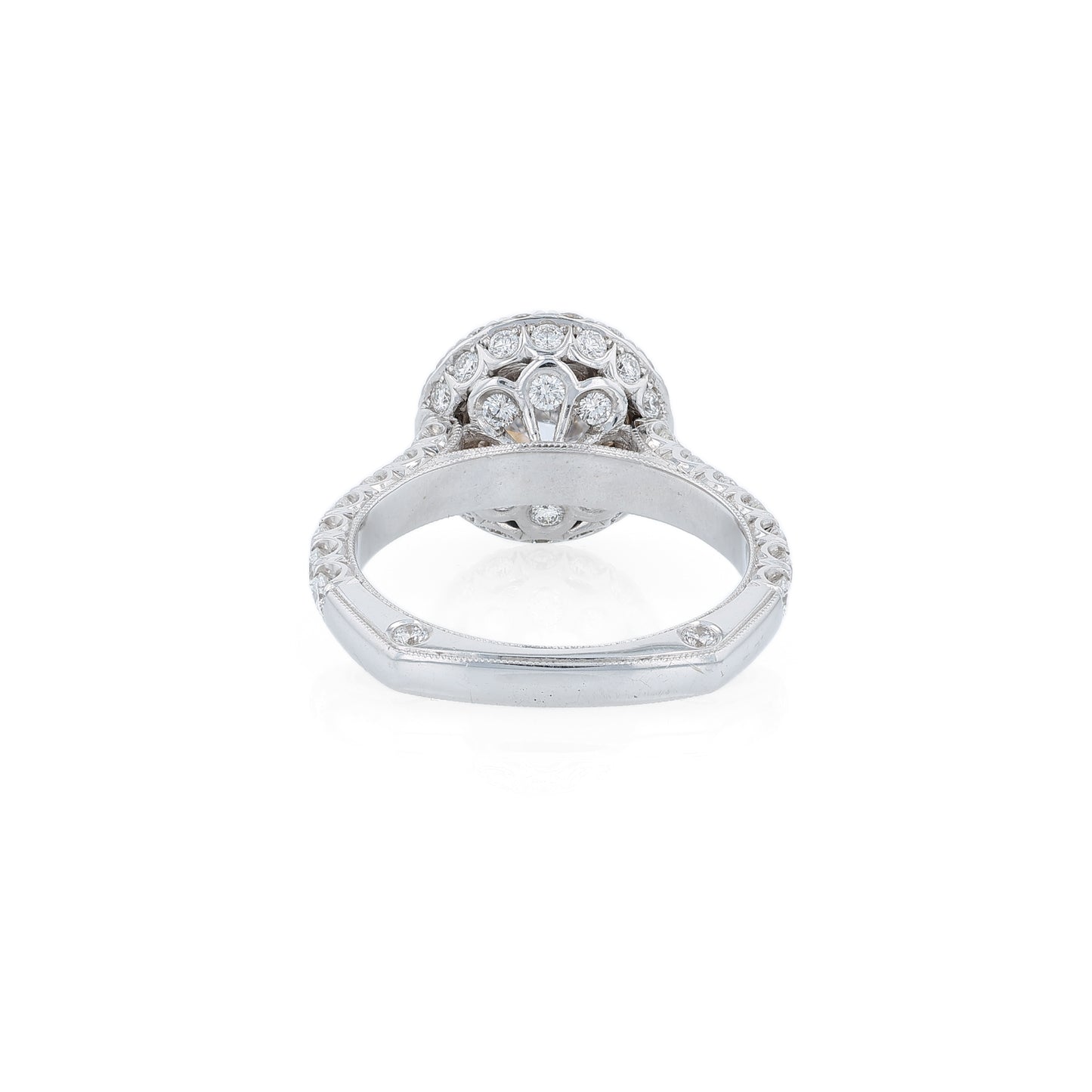 White gold diamond halo engagement ring with diamond accents and a round cubic zirconia center on a white background