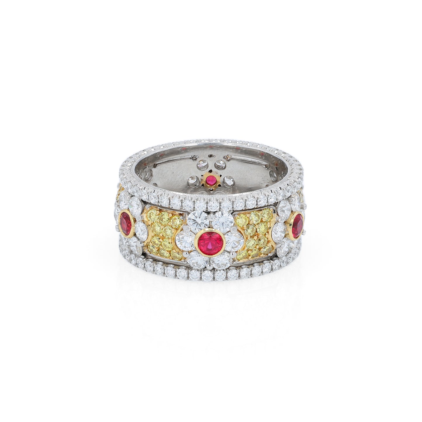 Platinum ring with ruby and white/yellow diamond accents on a white background