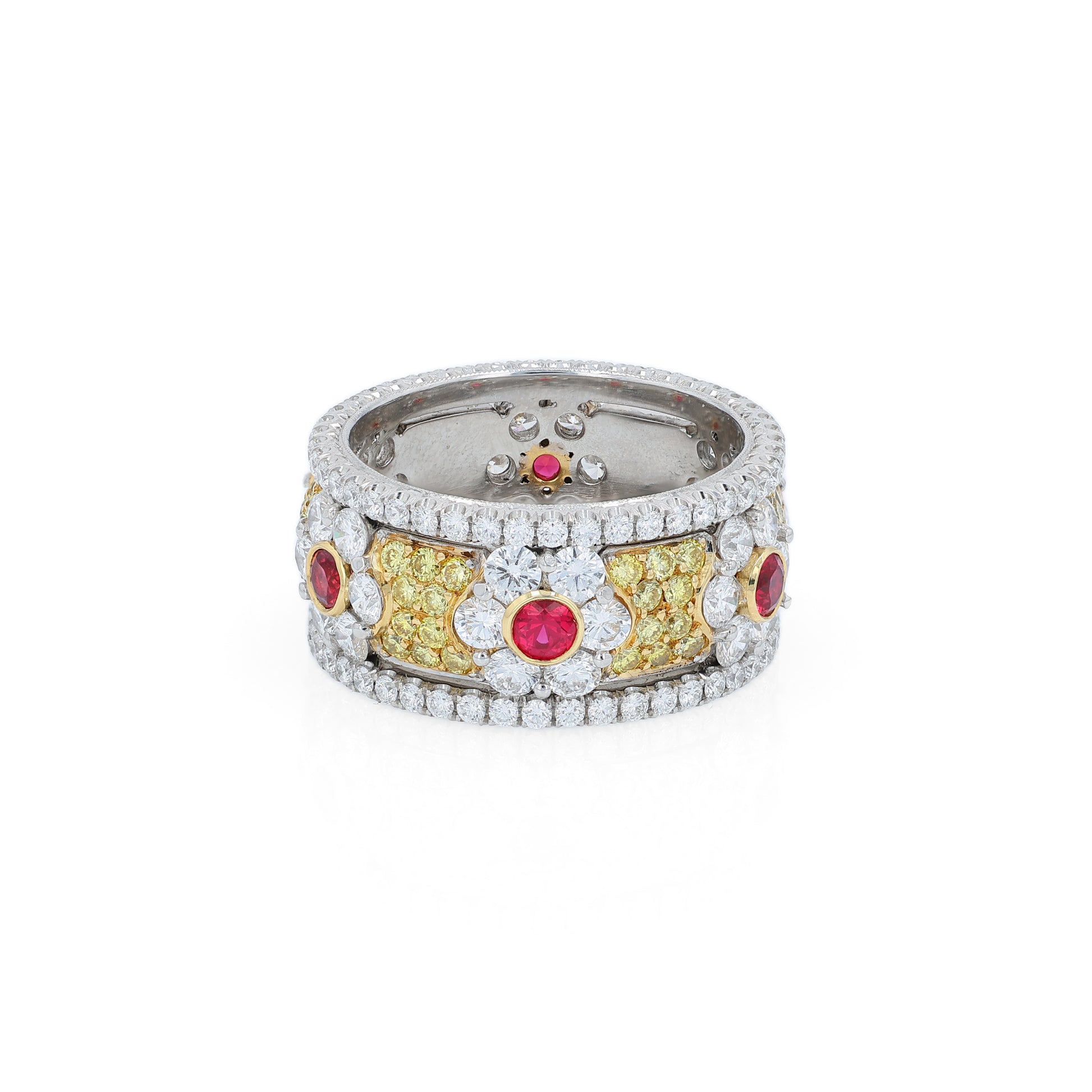 Platinum ring with ruby and white/yellow diamond accents on a white background
