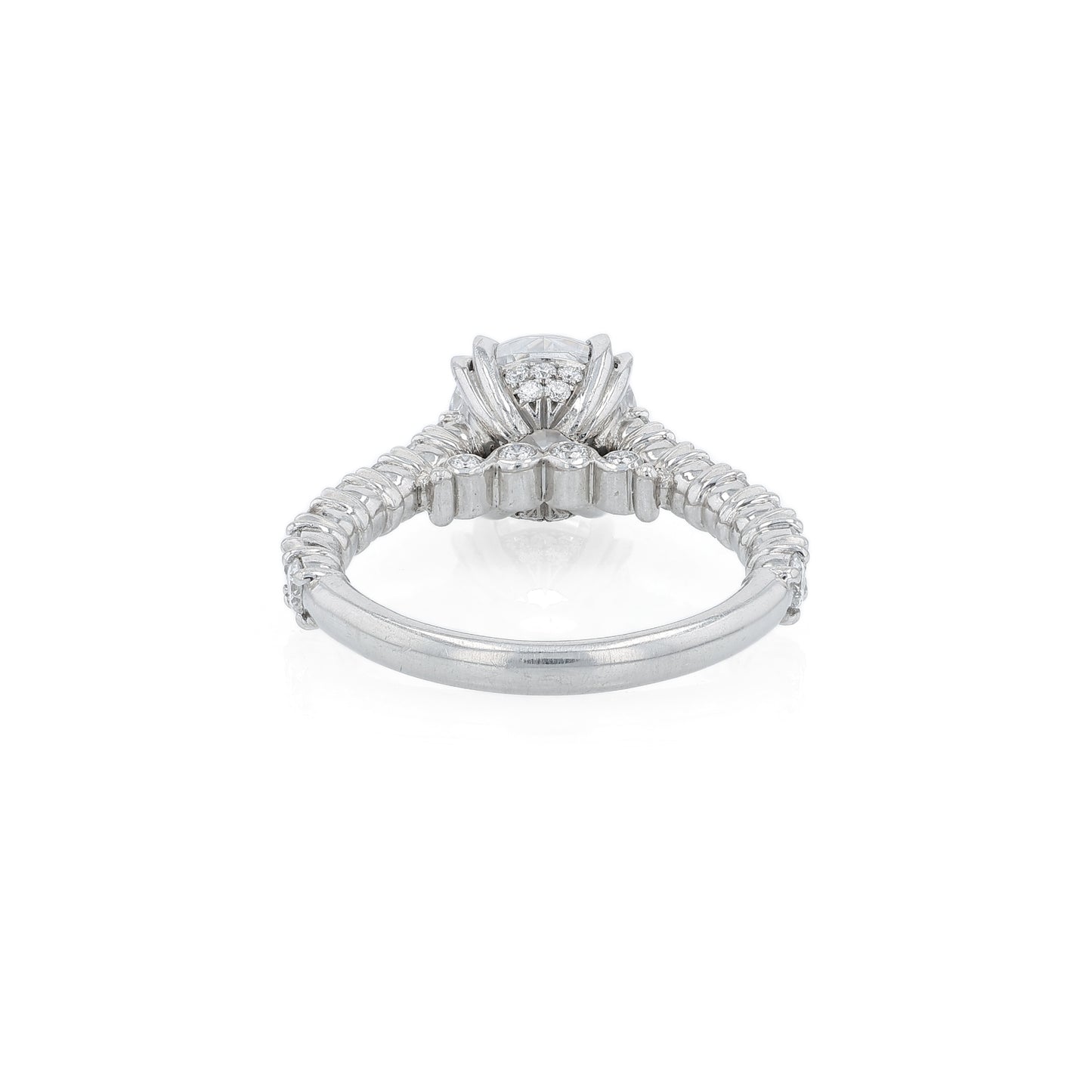 Platinum diamond engagement ring with diamond accents and a round cubic zirconia center on a white background