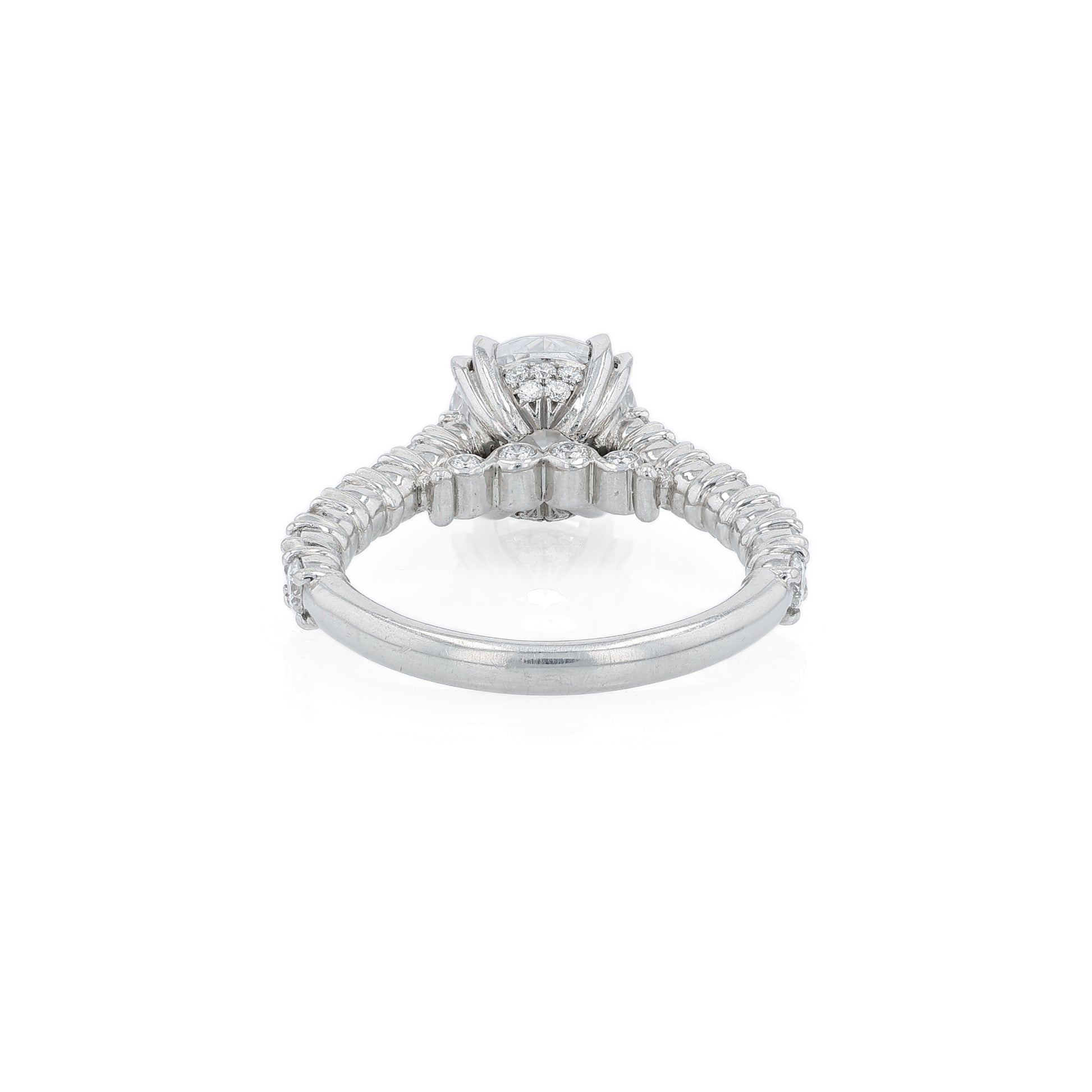 Platinum diamond engagement ring with diamond accents and a round cubic zirconia center on a white background