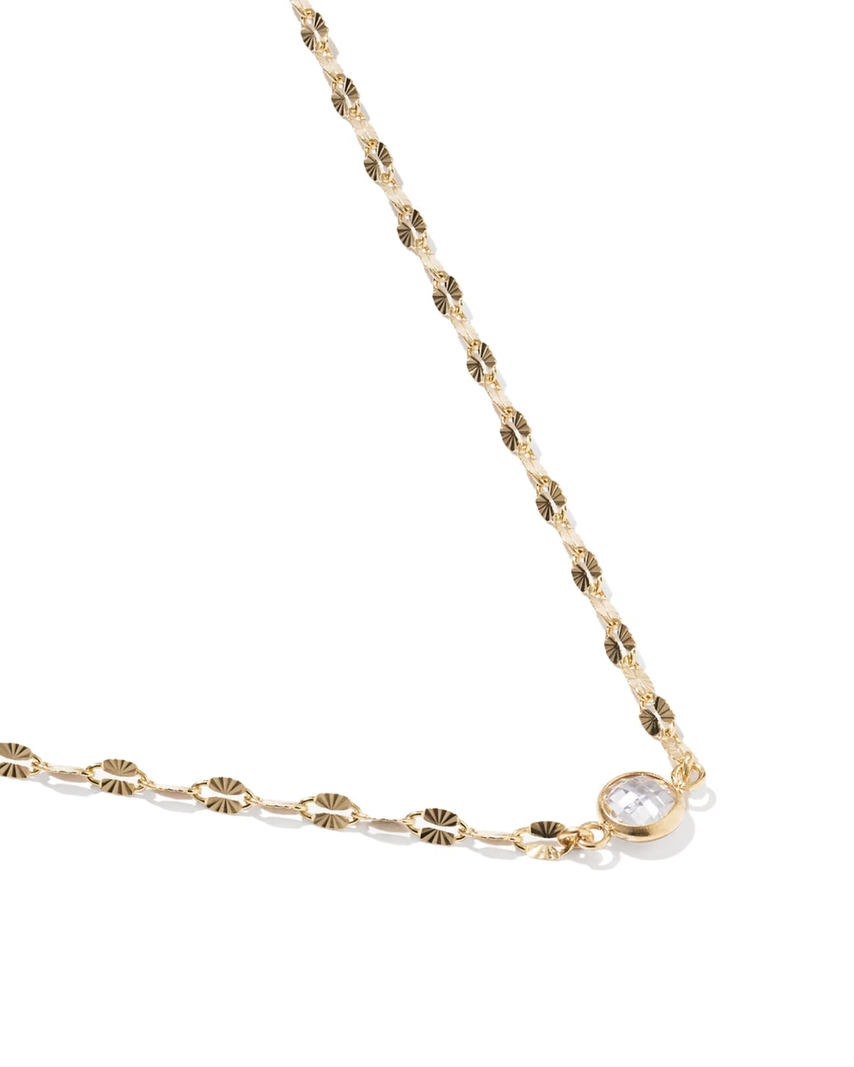 A gold chain necklace featuring textured oval links and a bezel-set clear round stone, photographed on a clean white background.