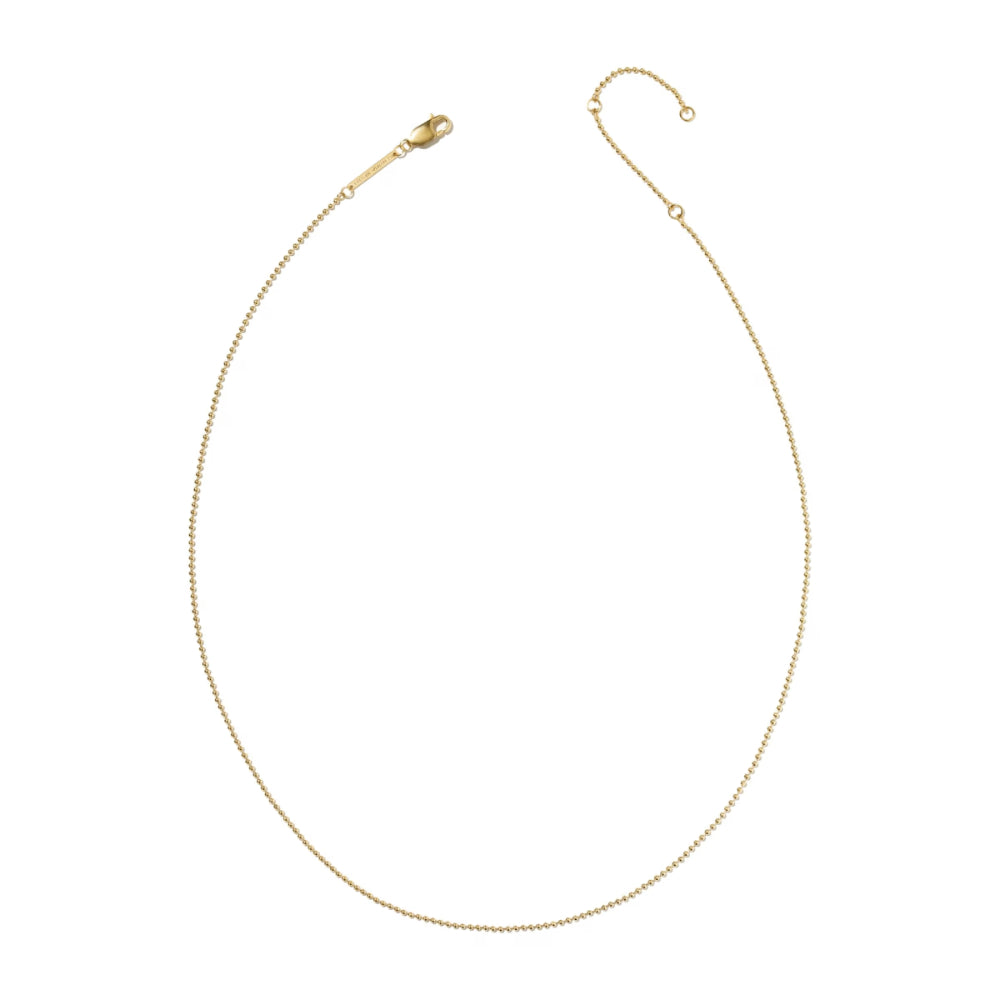 A delicate gold chain necklace with a lobster clasp and extender, displayed on a clean white background.