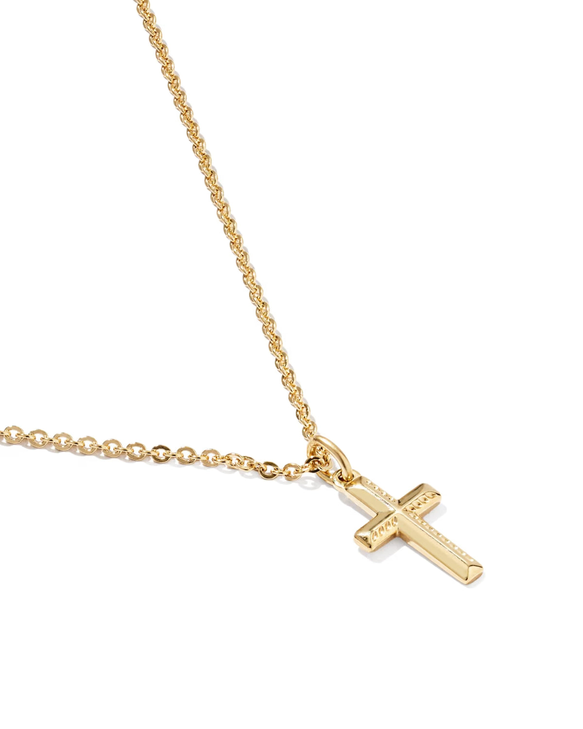 A gold cross pendant necklace on a delicate gold chain, photographed against a clean white background.