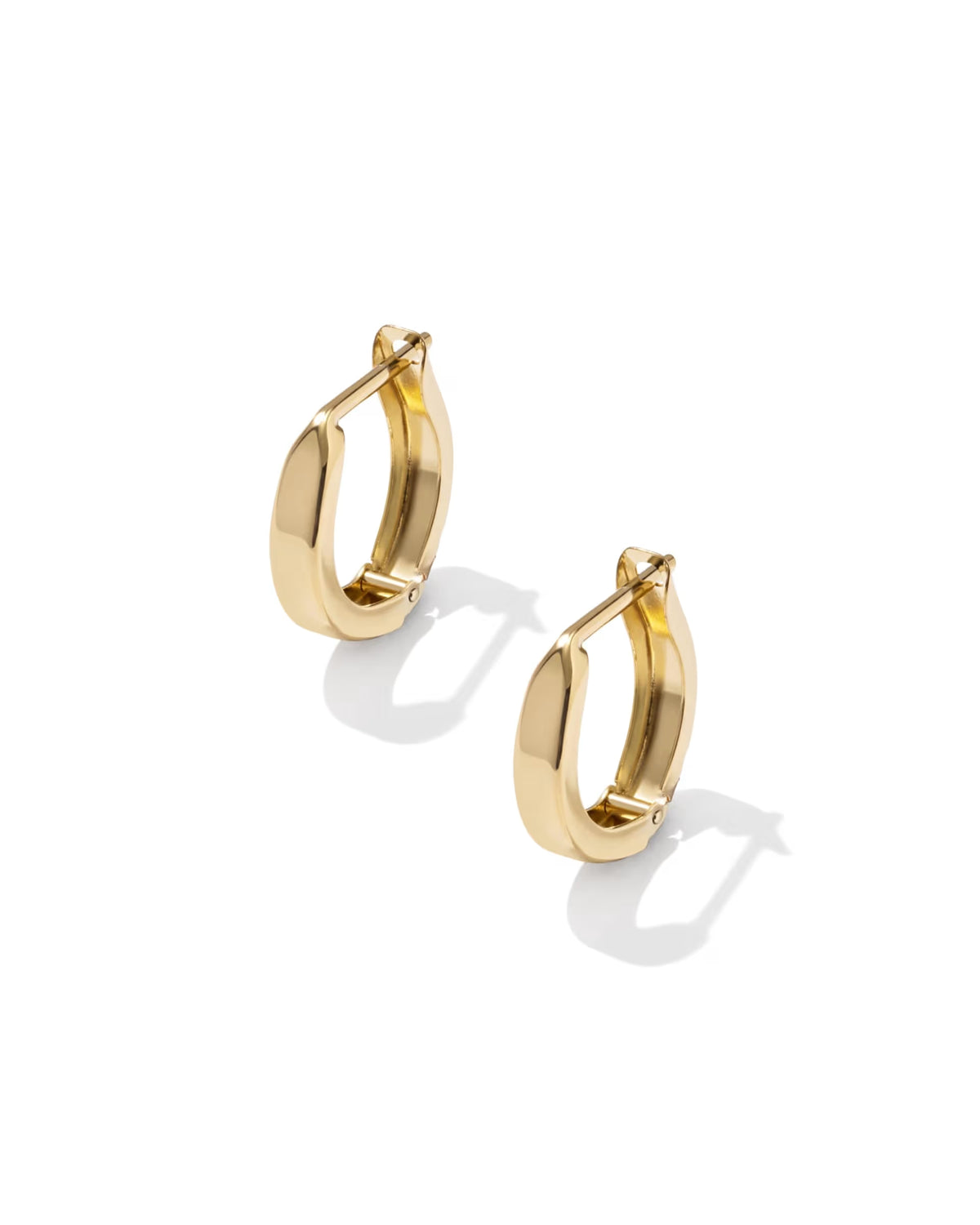A pair of polished yellow gold huggie hoop earrings shown on a clean white background with soft shadows.