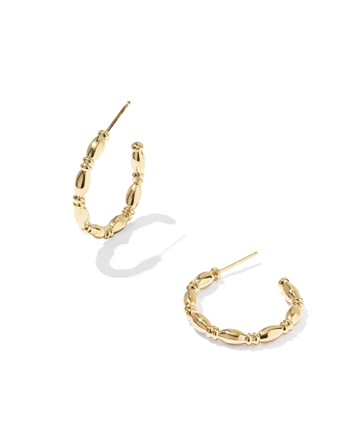 A pair of gold hoop earrings with a textured, beaded link design, displayed on a clean white background with soft shadows.