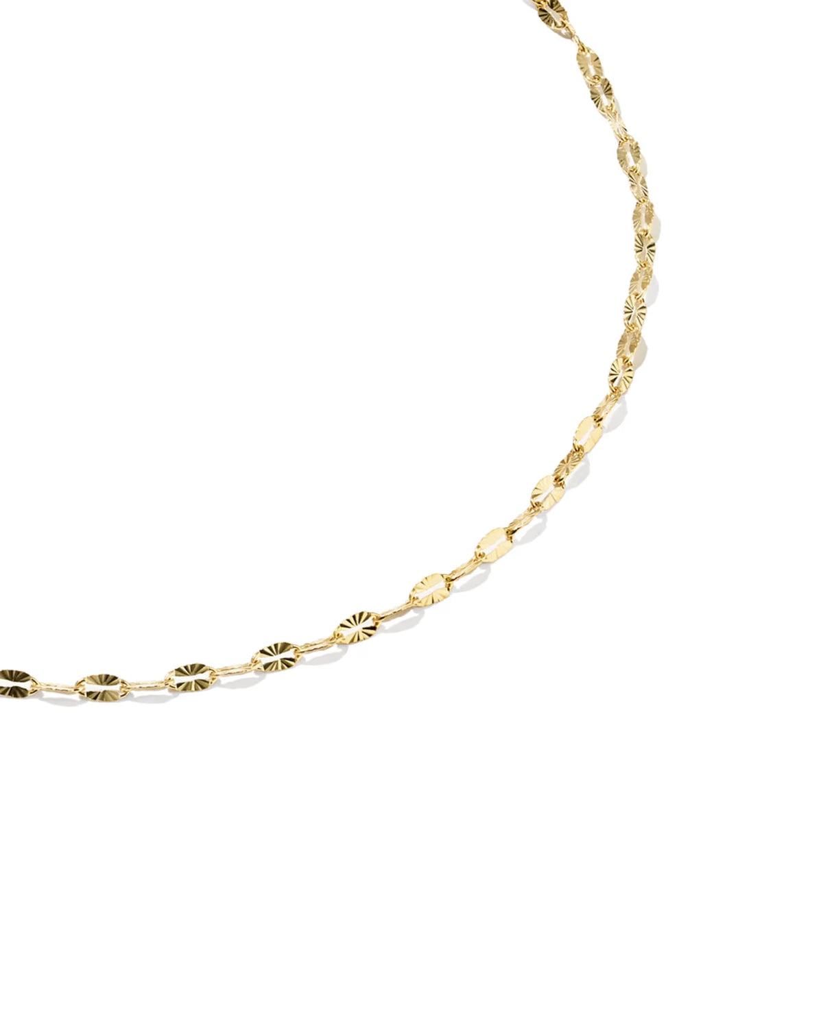 A delicate gold chain anklet with textured, sunburst-like oval links, photographed on a clean white background.