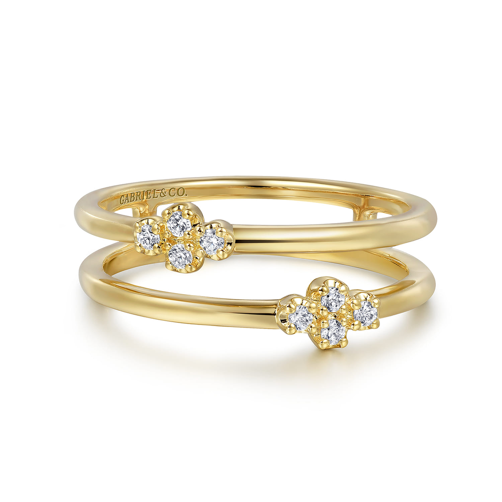 double row gold ring with diamonds on white background