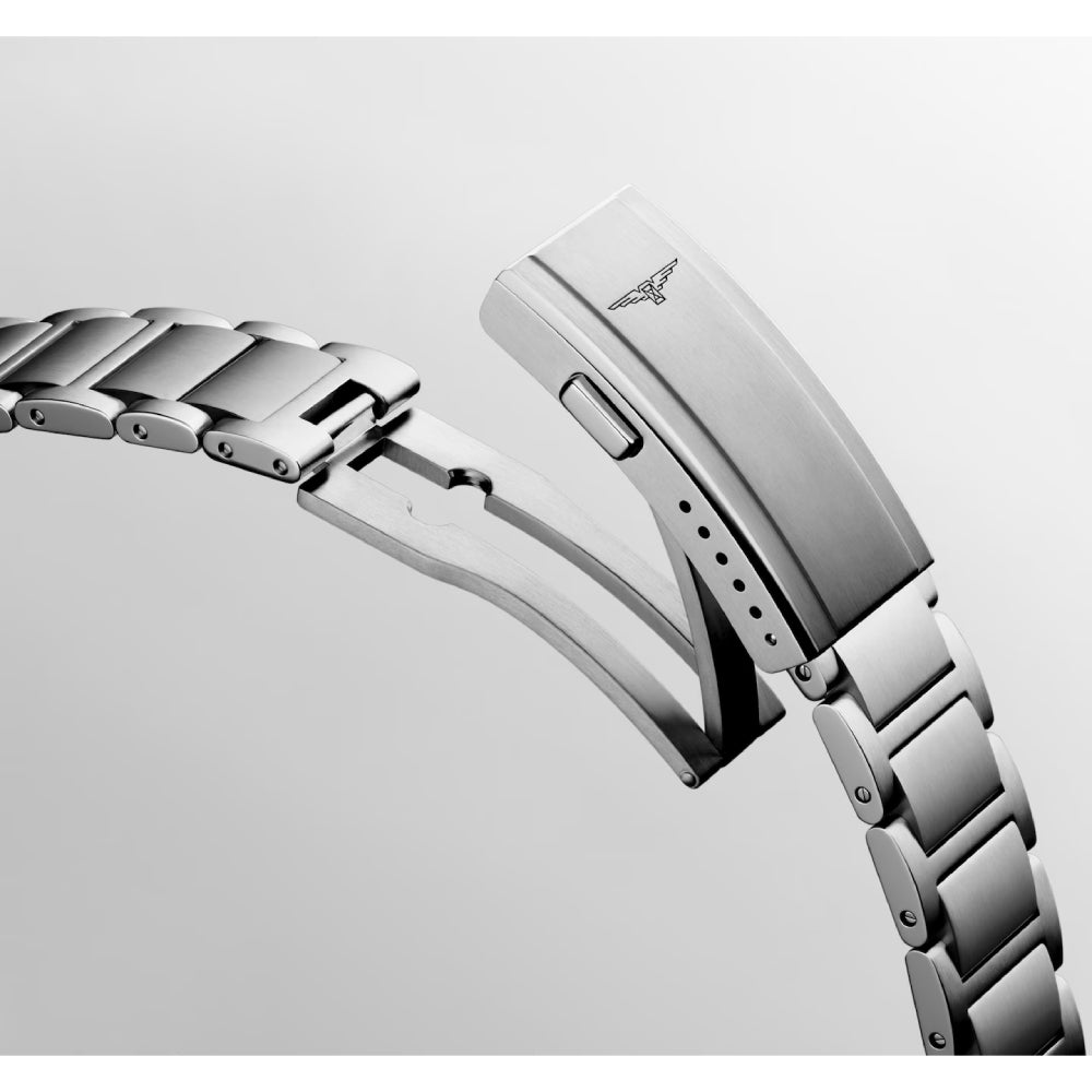Longines watch with blue dial and silver bracelet on a white background
