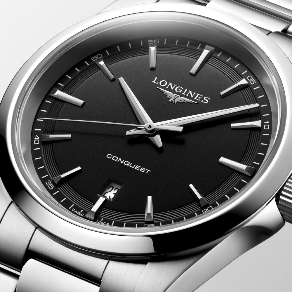 Longines stainless steel watch with a black sandblasted texture dial on a white background