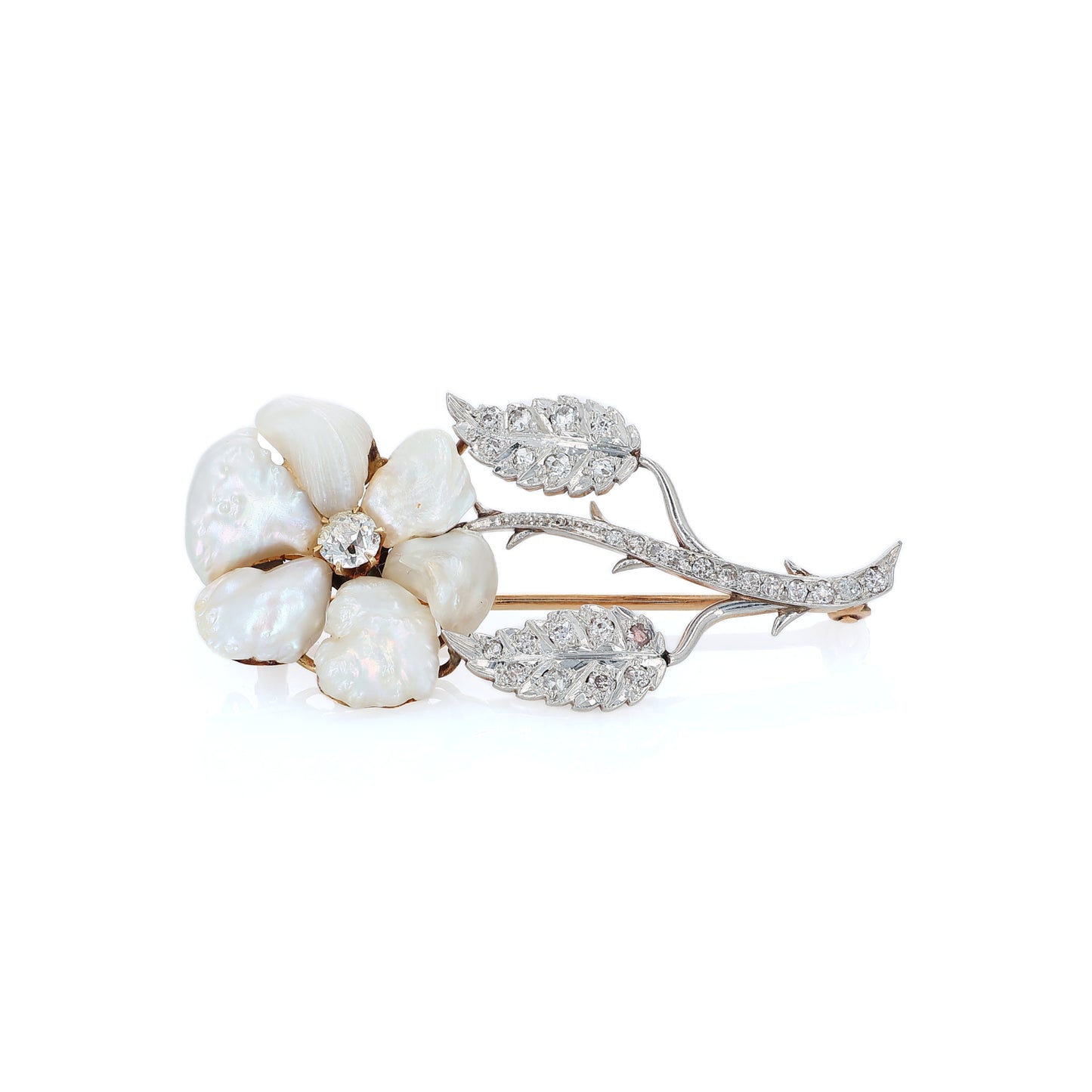 Platinum and yellow gold flower design pin with pearl petals and diamond accents on a white background