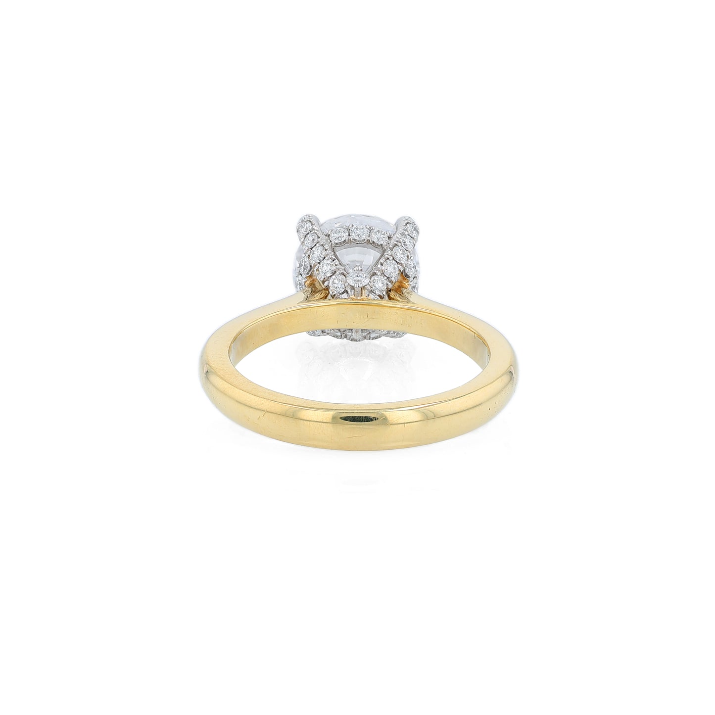 Yellow gold and platinum diamond engagement ring with diamond accents and a round cubic zirconia center on a white background