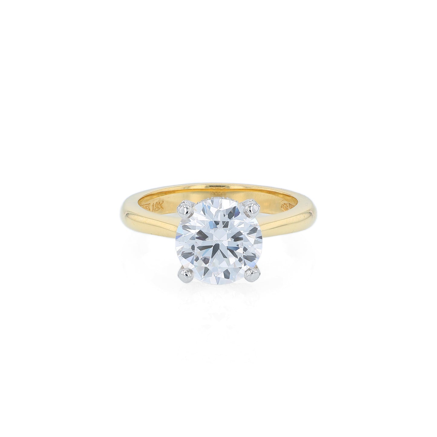 Yellow gold and platinum diamond engagement ring with diamond accents and a round cubic zirconia center on a white background